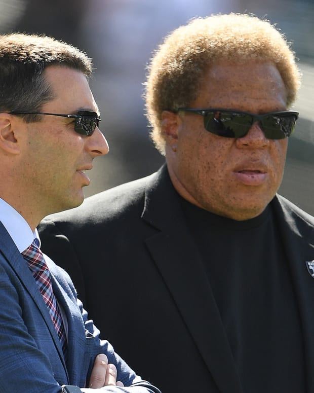 Tom Telesco and Reggie McKenzie